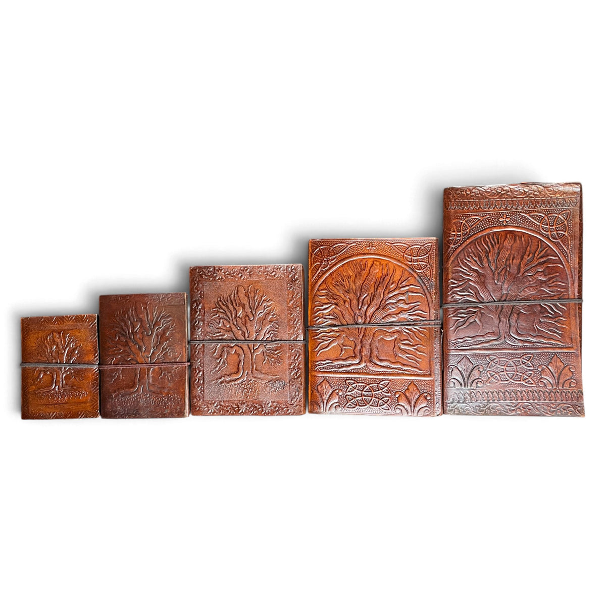 Tree of Life leather journals in 5 sizes side by side – from 8 × 10.5 cm to 13.5 × 23 cm