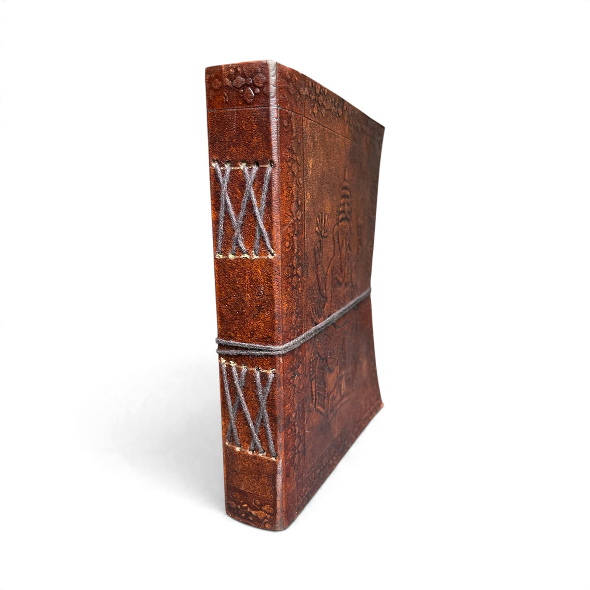Spine of the Ganesha leather journal with visible cross-stitch hand binding