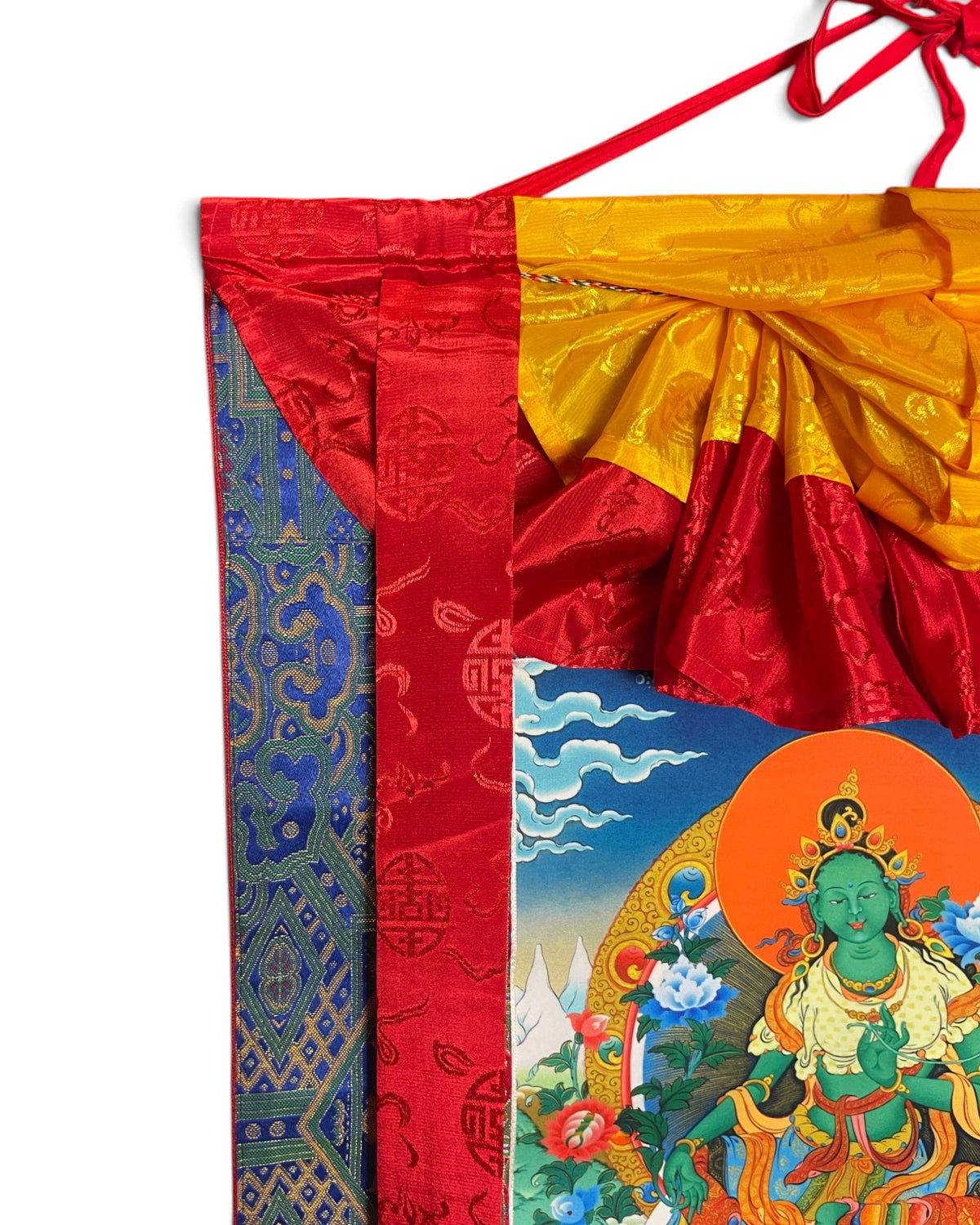 Green Tara thangka, top detail with yellow silk apron and hanging cord