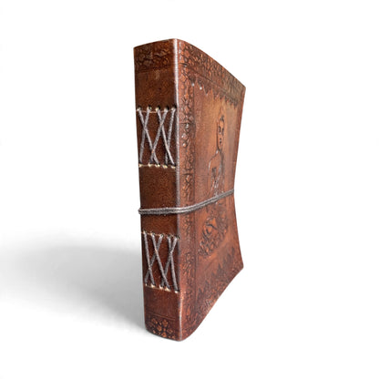 Spine of the Buddha leather journal with visible cross-stitch hand binding