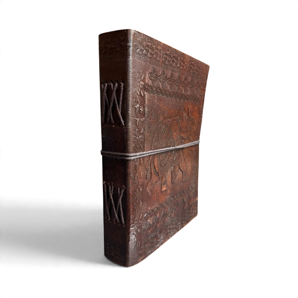 Spine of the Elephant leather journal with visible cross-stitch hand binding