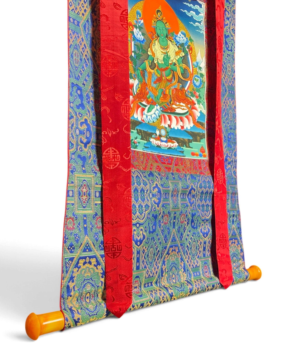 Green Tara thangka, bottom detail with rod and blue brocade