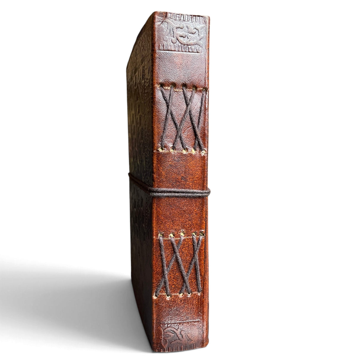 Spine of the leather journal with visible cross-stitch hand binding