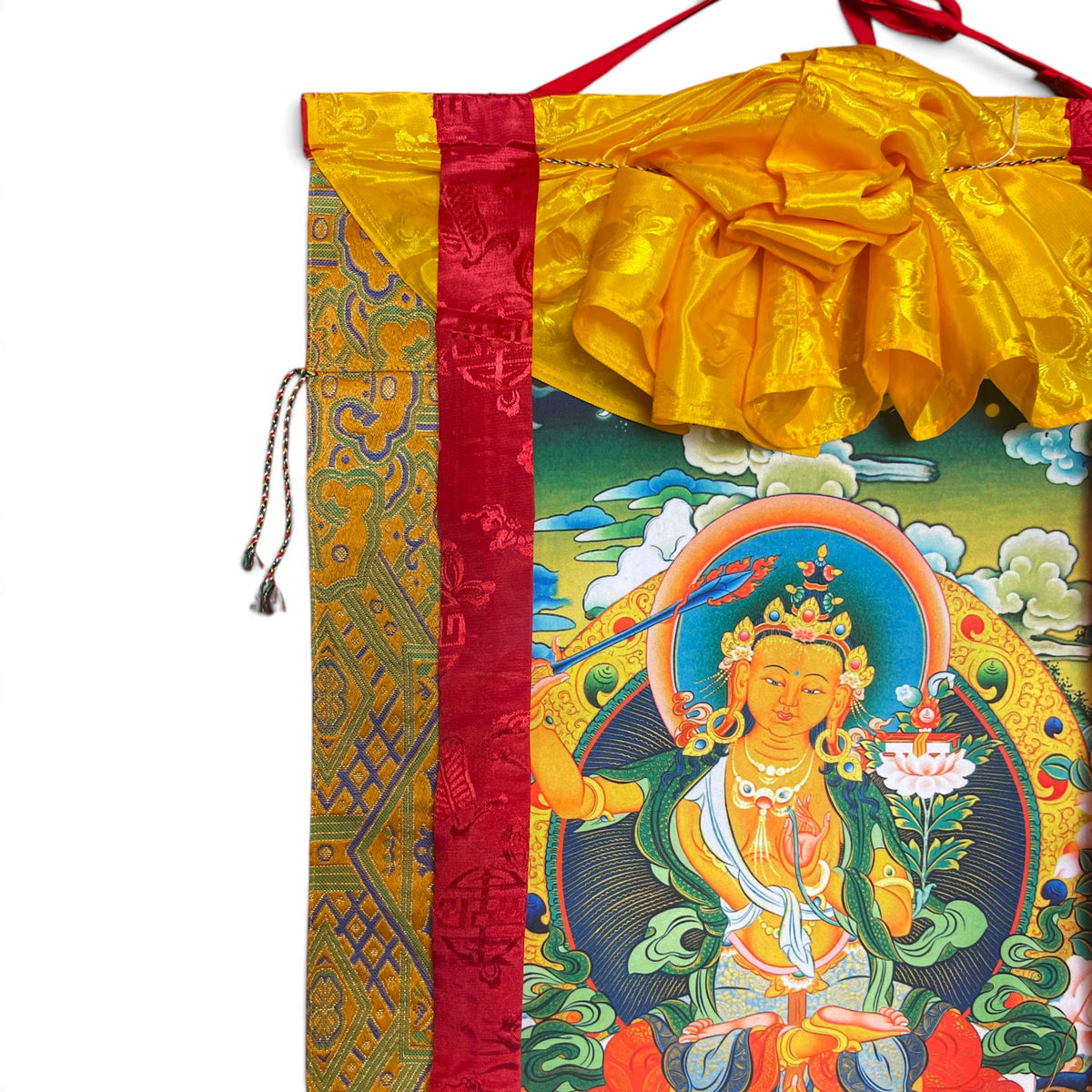Dettaglio del grembiule di seta giallo con broccato in alto sul thangka Manjushri
