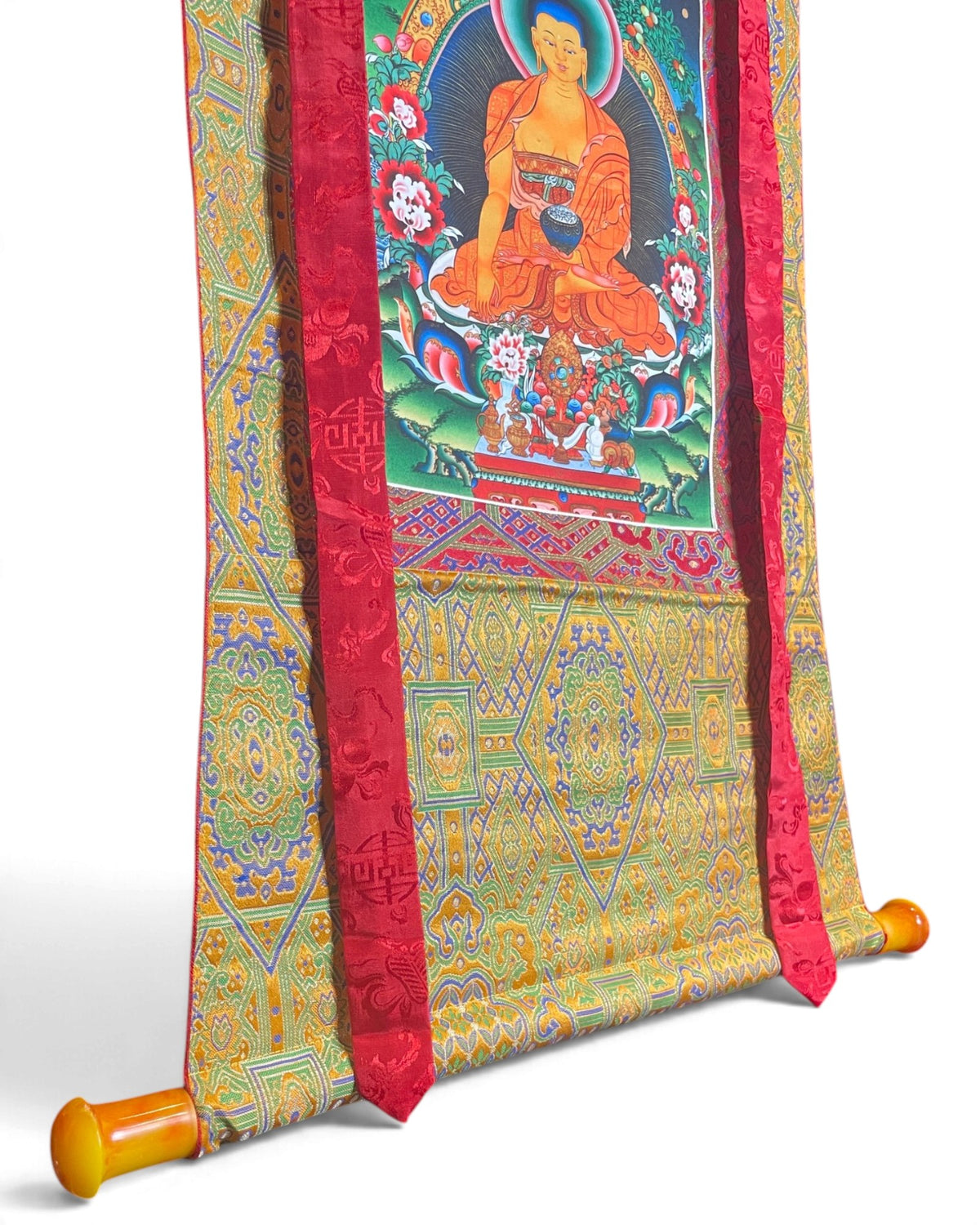 Thangka Bouddha Shakyamuni, détail du bas avec barre et brocart jaune