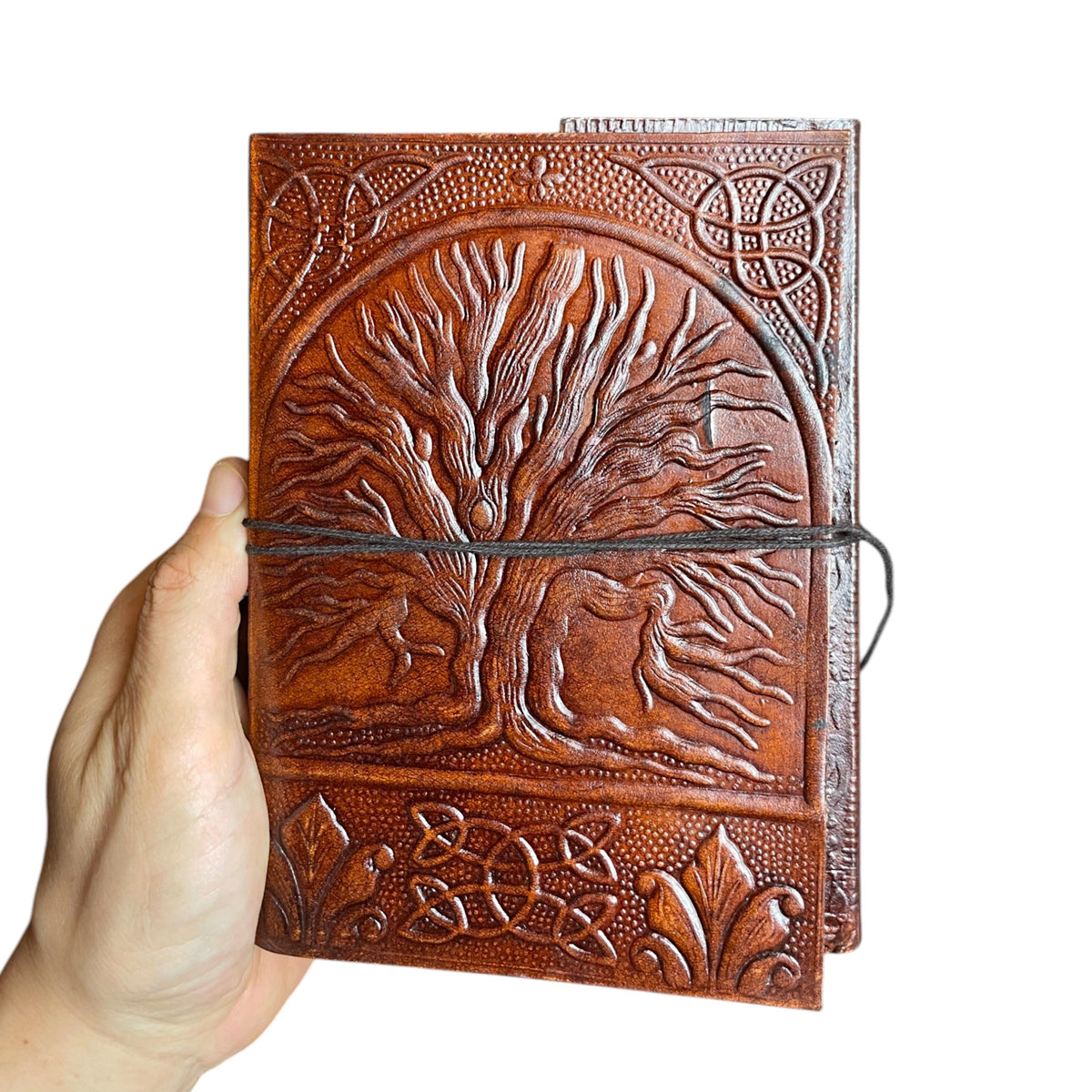 Tree of Life leather journal 13.5 × 18 cm in the hand – size comparison, Himalaya Vibes Bern