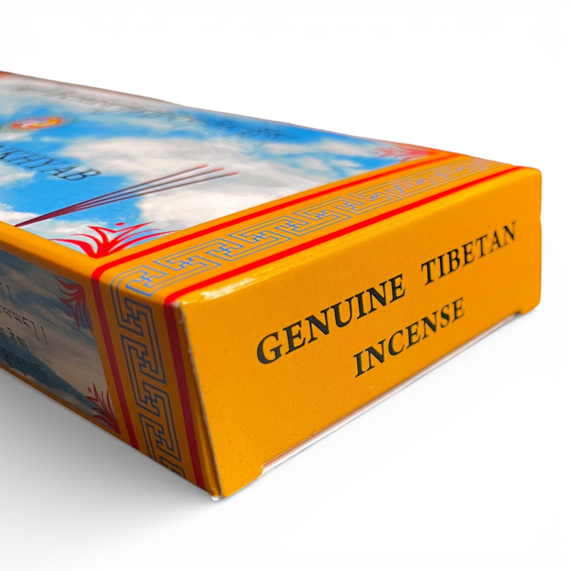 Seitenansicht der gelben Verpackung mit der Aufschrift „Genuine Tibetan Incense“.