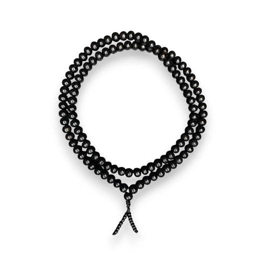 Ebenholz Mala 108 Perlen 6mm – schwarze Holz Mala Kette als Kreis gelegt, Himalaya Vibes Bern
